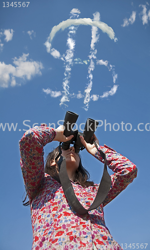 Image of Woman watching with binoculars