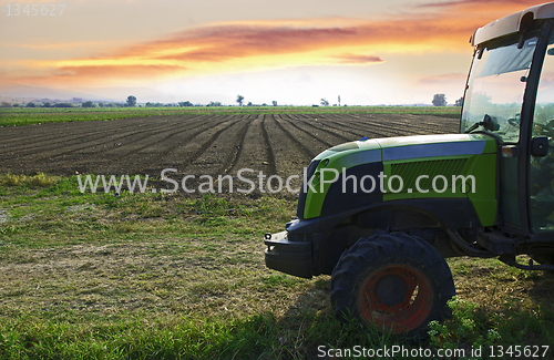 Image of Plowed land and tractor