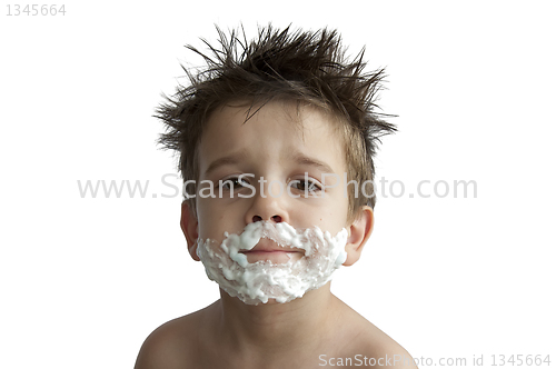 Image of A little boy shaving