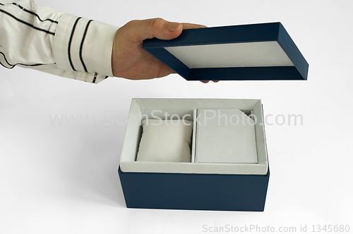 Image of Gift box with house inside