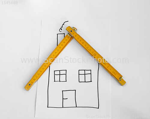 Image of Drawed house and wooden meter 