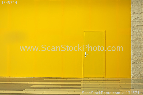 Image of Yellow wall with a door