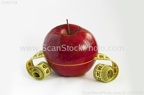 Image of Tape Measure with red Apple