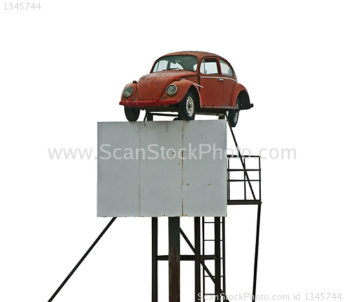 Image of Old car and billboard