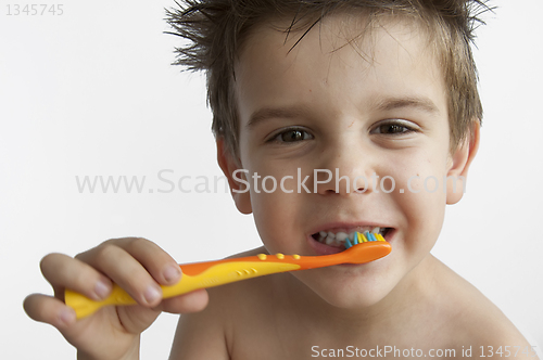 Image of Boy washing teeth 