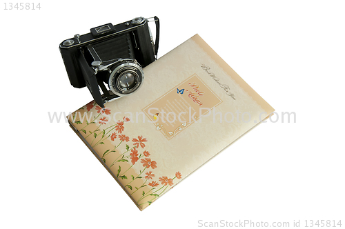 Image of Photo album and vintage camera