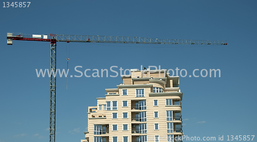 Image of Construction crane and a new building