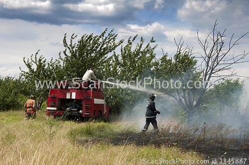 Image of Firefighters extinguish a fire