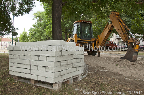 Image of Tile paths construction with loader