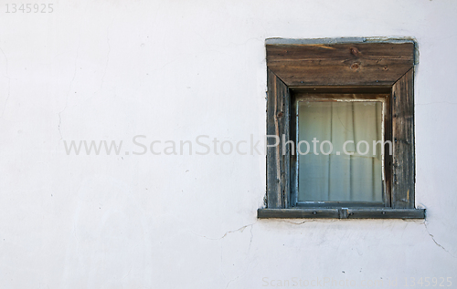 Image of Old window on the white wall