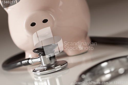 Image of Piggy Bank and Stethoscope with Selective Focus