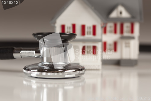 Image of Stethoscope with Small Model Home