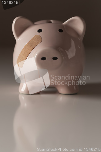 Image of Piggy Bank with Bandage on Face