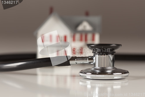 Image of Stethoscope with Small Model Home