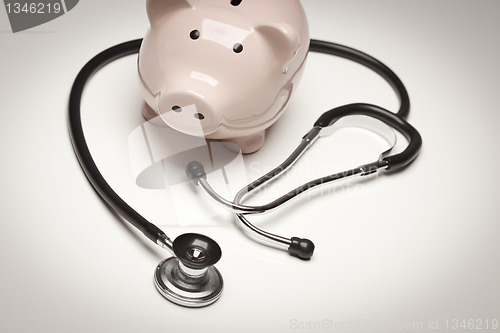 Image of Piggy Bank and Stethoscope with Selective Focus