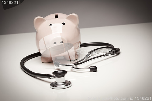 Image of Piggy Bank and Stethoscope with Selective Focus