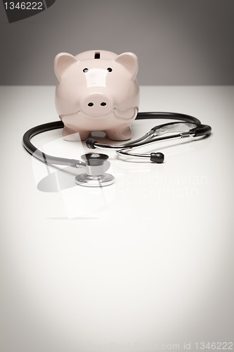 Image of Piggy Bank and Stethoscope with Selective Focus