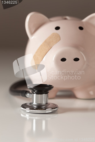 Image of Piggy Bank and Stethoscope with Selective Focus