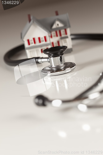 Image of Stethoscope with Small Model Home