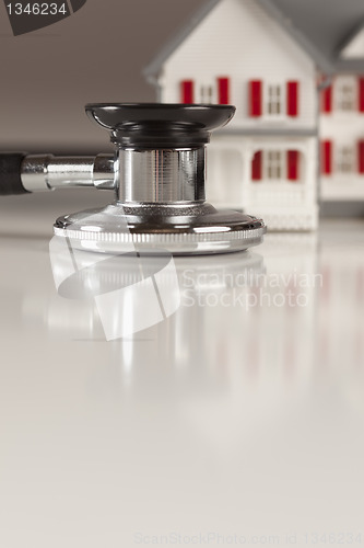 Image of Stethoscope with Small Model Home