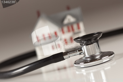 Image of Stethoscope with Small Model Home