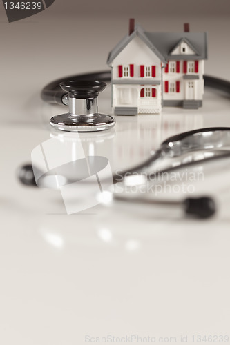 Image of Stethoscope with Small Model Home