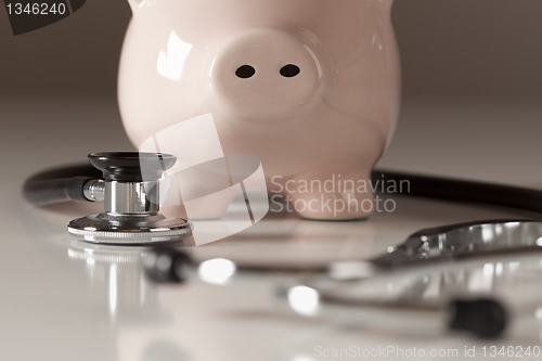 Image of Piggy Bank and Stethoscope with Selective Focus