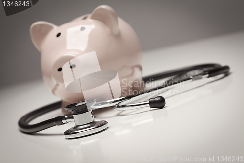 Image of Piggy Bank and Stethoscope with Selective Focus