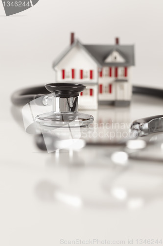 Image of Stethoscope with Small Model Home