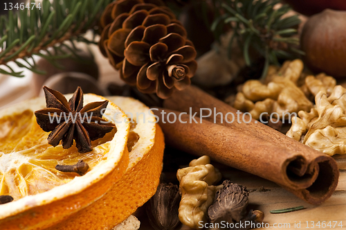 Image of Different kinds of spices, nuts and dried oranges - christmas de