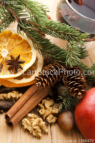 Image of Different kinds of spices, nuts and dried oranges - christmas de