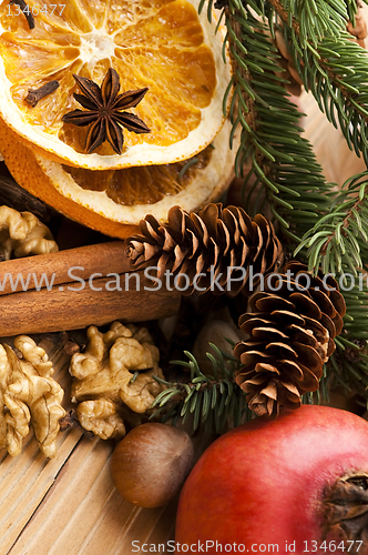 Image of Different kinds of spices, nuts and dried oranges - christmas de