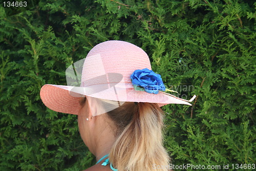 Image of Girl with pink hat and pony-tail