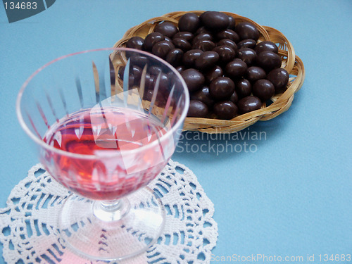 Image of Glass of liquor and sweet