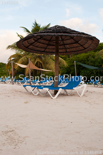 Image of Beach chairs and umbrella