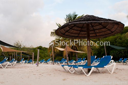 Image of Beach chairs and umbrella