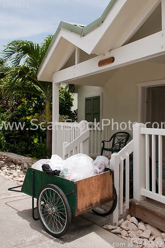 Image of Cleaning cart outside villa