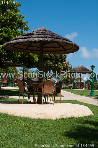 Image of Umbrella and chairs