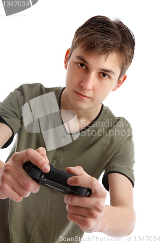 Image of Teenage boy playing video game