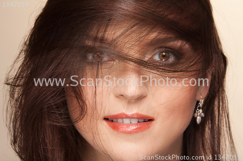 Image of Face and hairs on wind