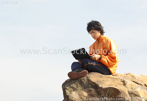 Image of asain Man with notebook 