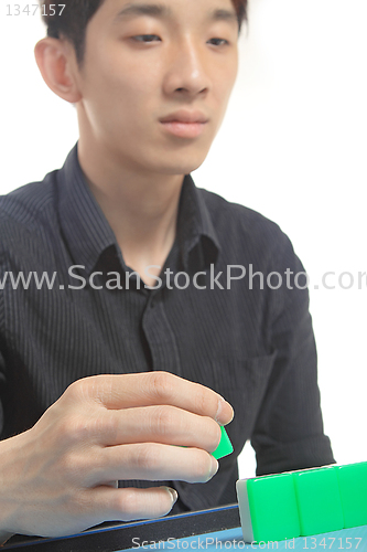 Image of Chinese man play Mahjong, traditional China gamble. 