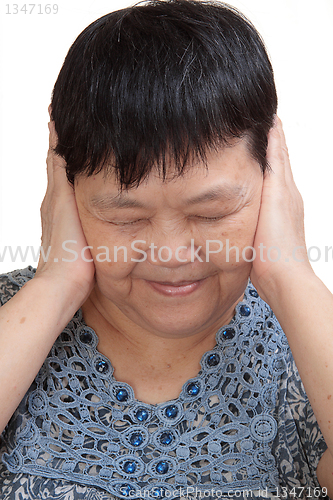 Image of Woman covering her ears - Hear no evil