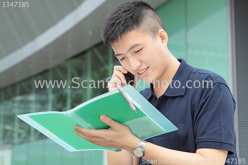 Image of Portrait of businessman calling by phone 