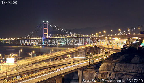 Image of highway and bridge at night
