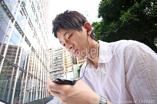 Image of Businessman Using a Hands Free Device 