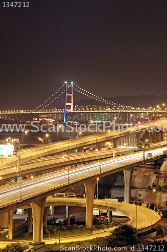 Image of highway and bridge at night