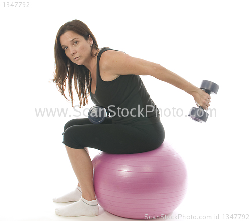 Image of middle age senior woman fitness exercising  dumbbell weights cor