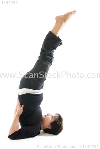 Image of woman yoga position toe raise Half Shoulderstand -- Ardha Sarvan