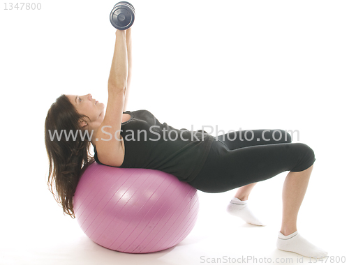 Image of middle age senior woman fitness exercising  dumbbell weights cor